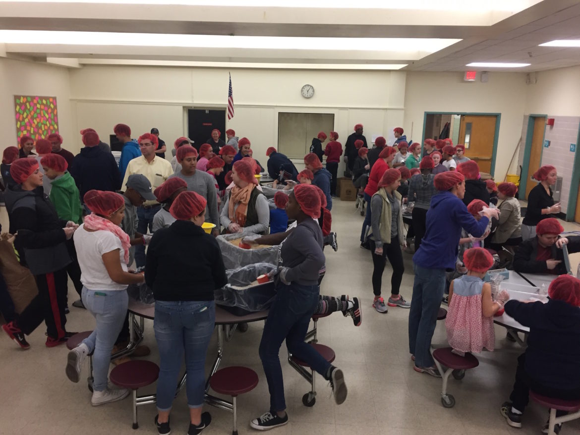 More than 90 Rotarians, and Watertown Middle School teachers and students packed meals for Stop Hunger Now.