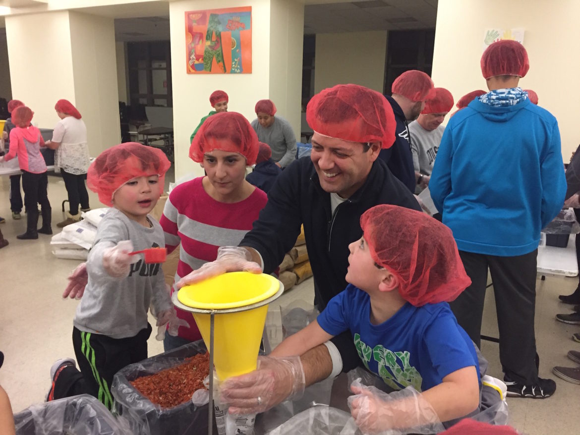 Watertown Rotarians and Watertown Middle School students packed more than 10,000 meals for the hungry at a recent event.